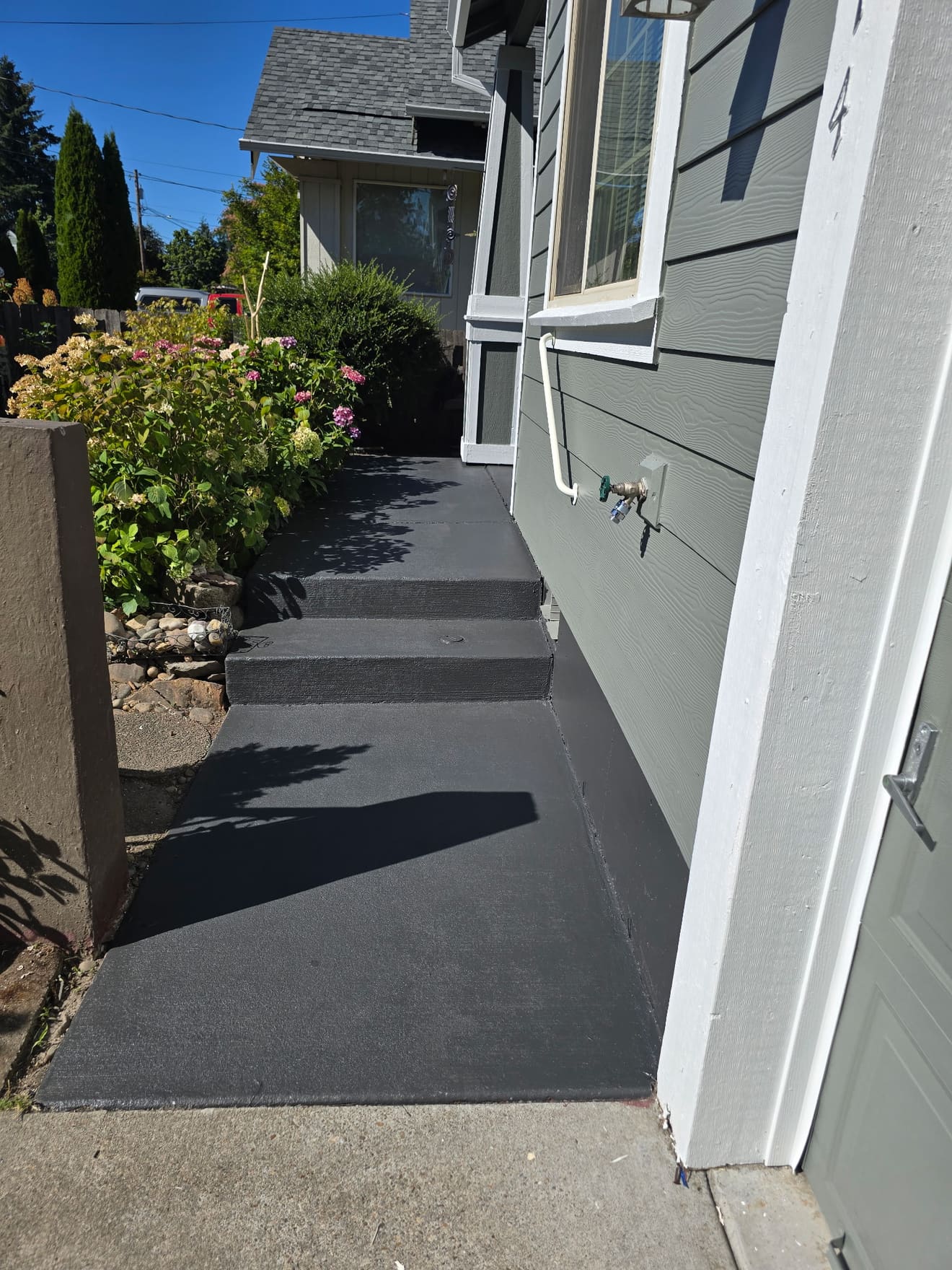 Front walkway and steps after charcoal concrete coating