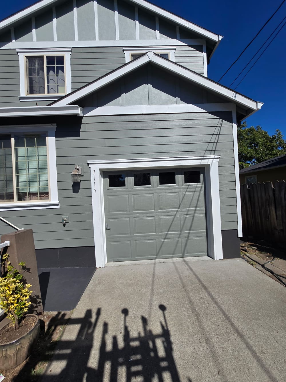 Close-up of a freshly painted garage door and trim